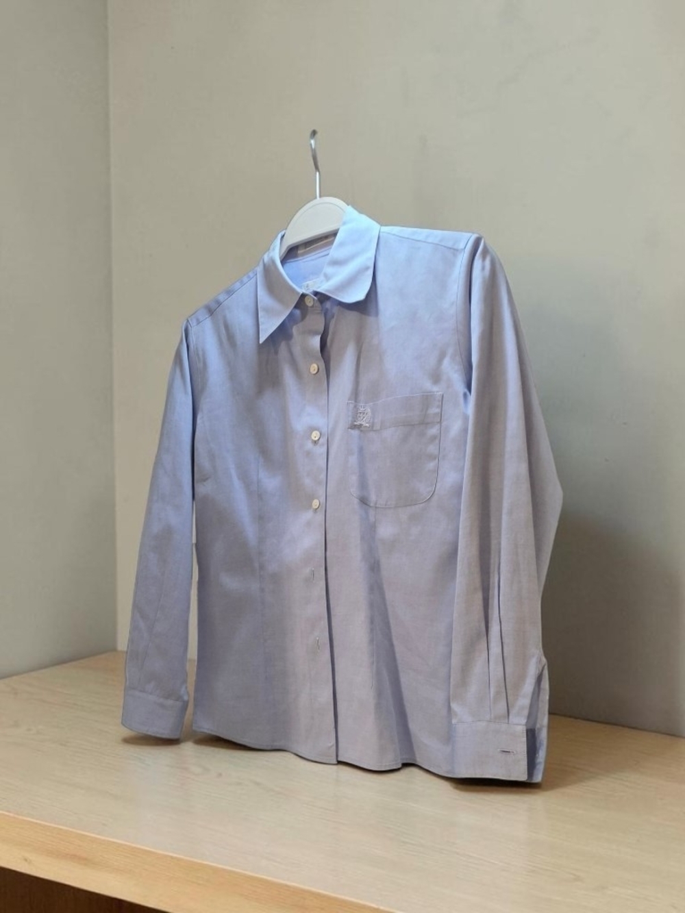 Classic light blue Oxford button-down shirt by The White Buffalo Collection. Mad